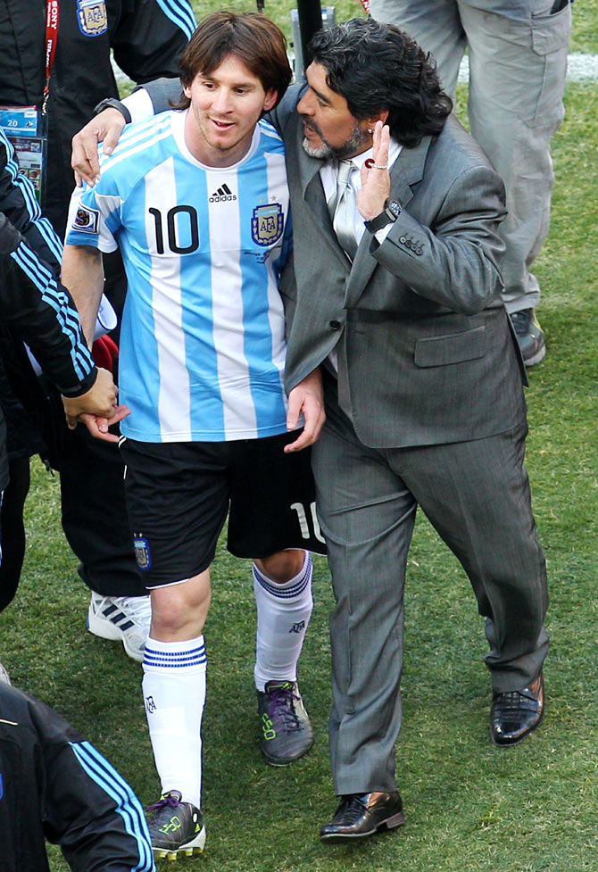 Diego Maradona (right) talks with Lionel Messi