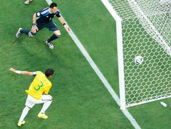 Thiago Silva send the ball past Colombia’s goalkeeper, David Ospina