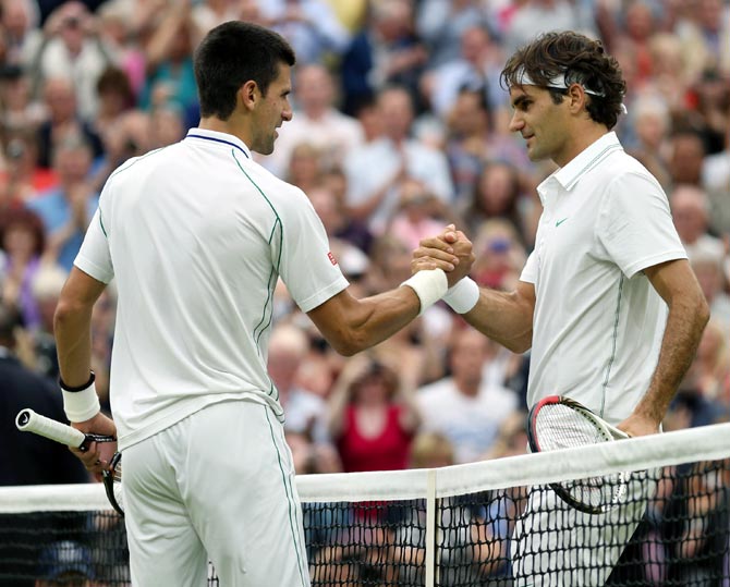 Roger Federer of Switzerland (right) with Novak Djokovic of Serbia