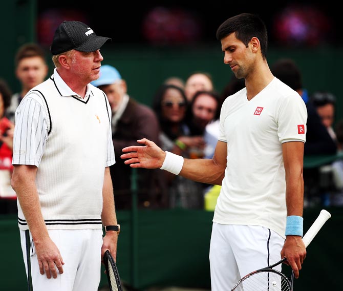 Novak Djokovic (right) with his coach Boris Becker during a practice session