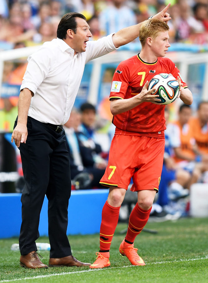 Head coach Marc Wilmots gestures as Kevin De Bruyne of Belgium prepares for a throw in during their  2014 FIFA World Cup quarter-final against Argentina at Estadio Nacional in Brasilia on Saturday