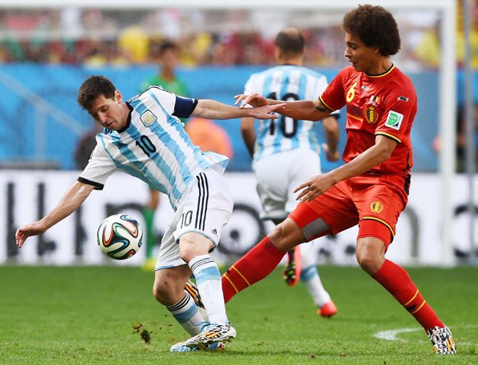 Lionel Messi of Argentina is challenged by Axel Witsel of Belgium during their 2014 FIFA World Cup quarter-final on Saturday