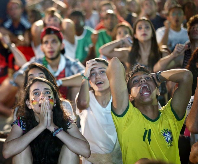 Fans react during the Germany-Algeria match at FIFA Fan Fest at Copacabana Beach