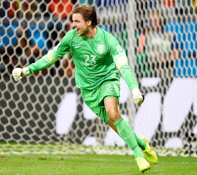 Goalkeeper Tim Krul of the Netherlands celebrates after making a save on a penalty kick by Michael Umana of Costa Rica