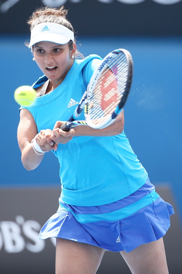 Sania Mirza of India plays a backhand