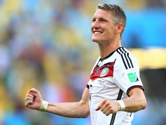 Bastian Schweinsteiger of Germany celebrates defeating France 1-0