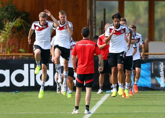 Matthias Ginter, left, and Sami Khedira of Germany jump during the German national team training