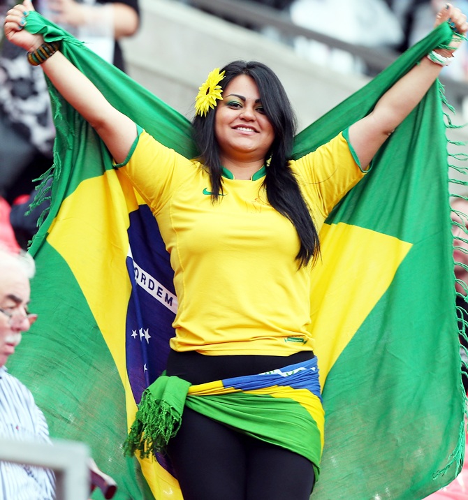 A Brazilian fan cheers