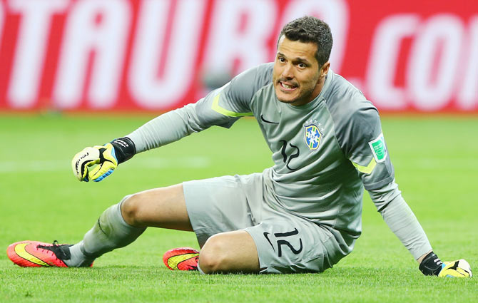 Goalkeeper Julio Cesar of Brazil reacts after letting in a goal against Germany on Tuesday