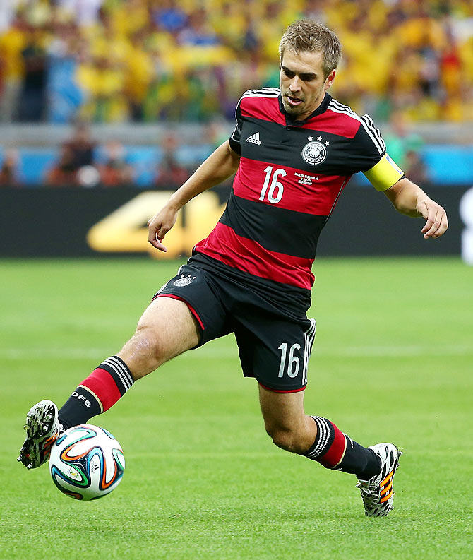 Philipp Lahm of Germany controls the ball during the 2014 FIFA World Cup semi-final against Brazil at Estadio Mineirao on Tuesday