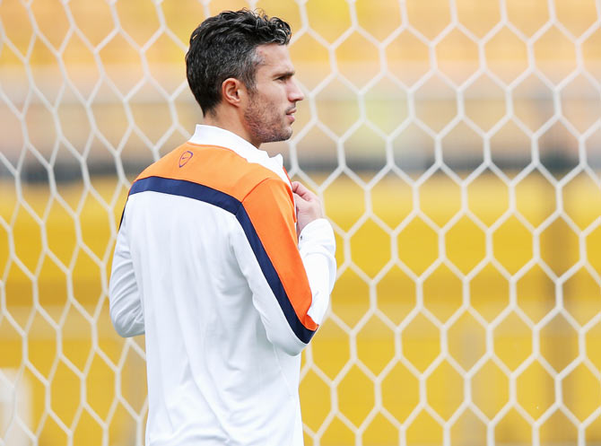 Robin van Persie looks on during the Netherlands training session at the 2014 FIFA World Cup Brazil held at the Estadio Paulo Machado de Carvalho Pacaembu in Sao Paulo on Tuesday
