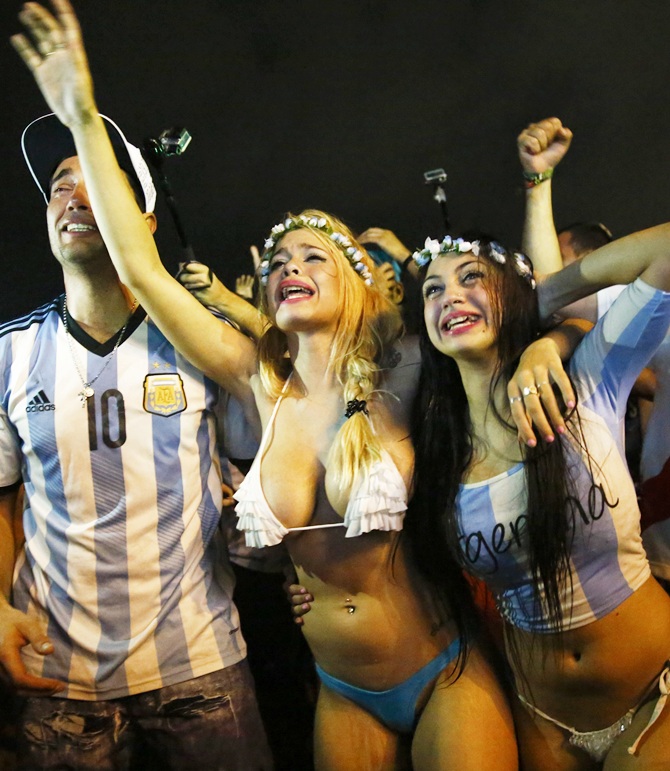 Argentina fans celebrate after their team won the 2014   World Cup semi-final match against the Netherlands as they watched at Copacabana   beach in Rio de Janeiro