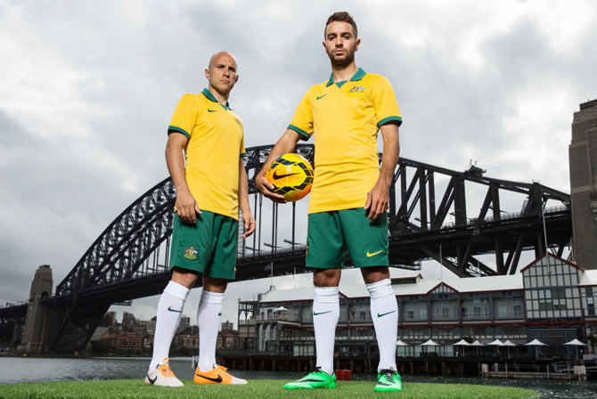 Mark Bresciano and Michael Zullo pose during the Australian Socceroos 2014 World Cup kit launch in Sydney