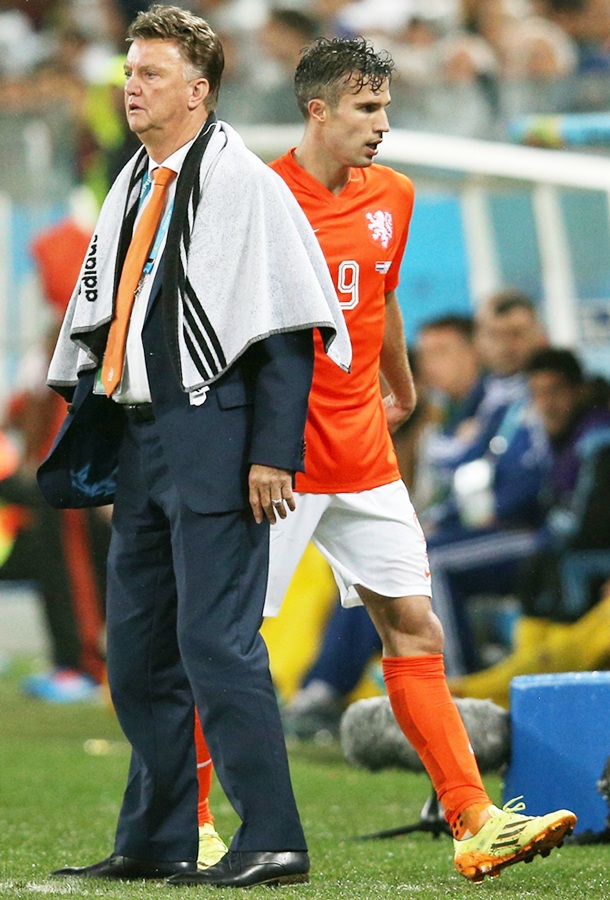 Head coach Louis van Gaal of the Netherlands looks on as Robin van Persie exits