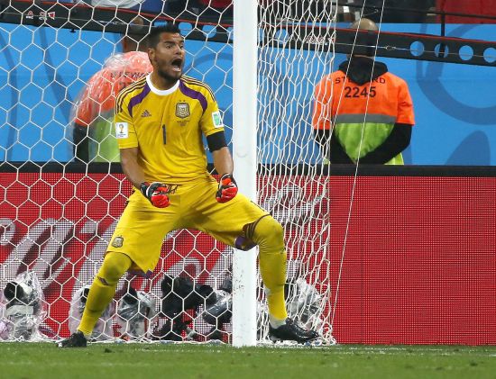 Argentina's goalkeeper Sergio Romero celebrates after saving a penalty kick