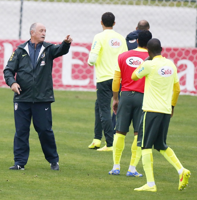 Brazil's national soccer team coach Luis Felipe Scolari, left, talks with his players during a training session in Teresopolis