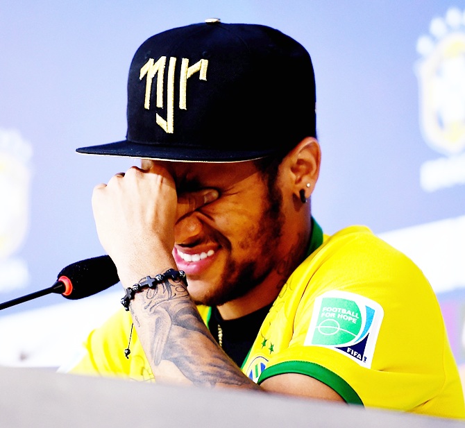 Neymar attends and speaks during a press conference in Teresopolis,   Brazil. Neymar apparently broke down in tears as he explained to the media that he was   relieved the recent accident which reportedly broke a vertebrae in his back did not leave him paralysed.