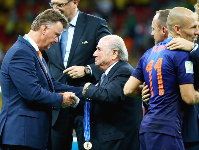 Head coach Louis van Gaal of the Netherlands is presented with his medal by FIFA   President Joseph S Blatter after defeating Brazil 3-0