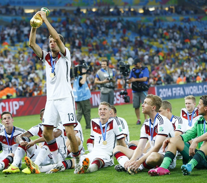 Manuel Neuer of Germany lifts the World Cup trophy with his team