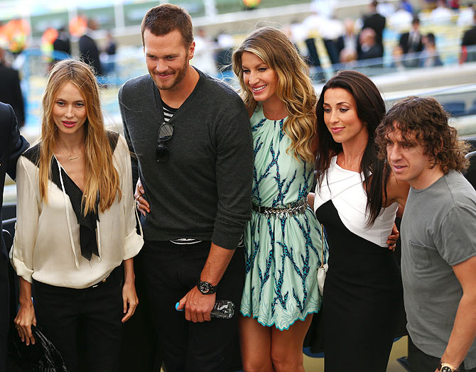 Vanessa Lorenzo (left), NFL athlete Tom Brady (2nd from left), model Gisele Bundchen (centre) and former Spanish international Carles Puyol (right) with a guest on prior to the FIFA World Cup final on Sunday
