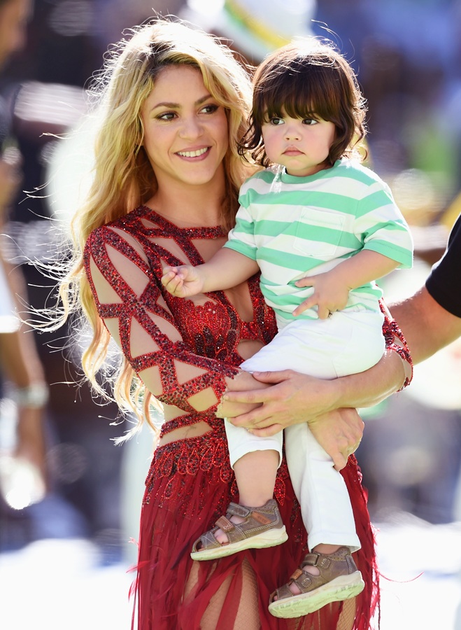 Singer Shakira and son Milan Pique look on during the closing ceremony