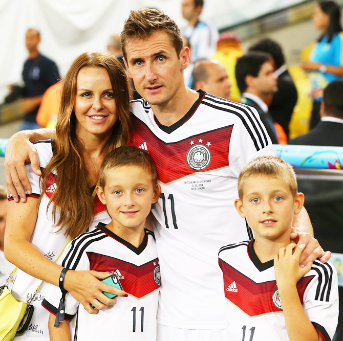 Miroslav Klose of Germany celebrates with wife Sylwia Klose and their sons