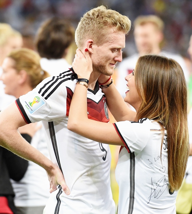 Andre Schuerrle of Germany celebrates with girlfriend Montana Yorke