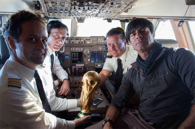 Germany coach Joachim Loew with the pilots on board the aircraft