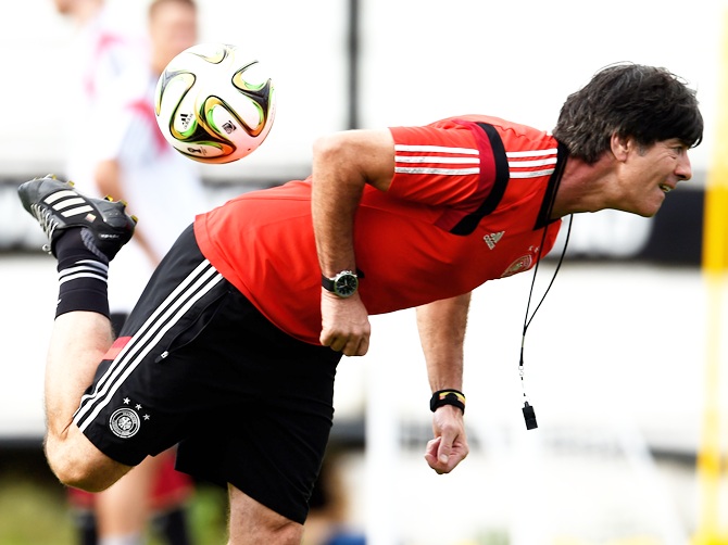Head coach Joachim Loew of Germany juggles a ball during the Germany training session