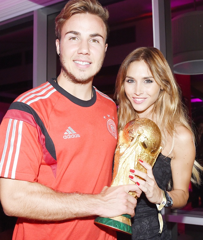 Goalscorer Mario Gotze of Germany and girlfriend Ann-Kathrin Brommel pose w...