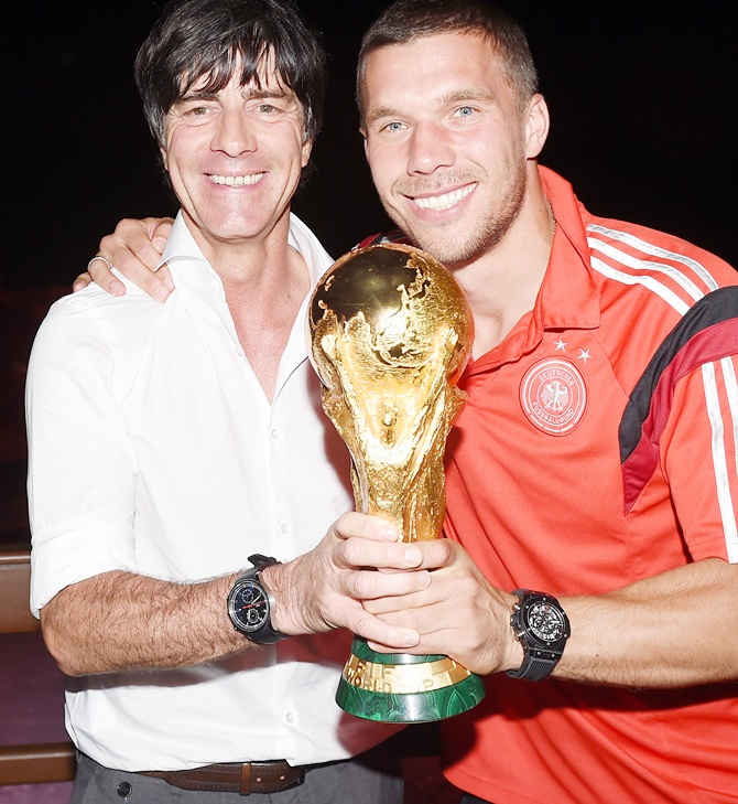 Germany head coach Joachim Loew and Lukas Podolski