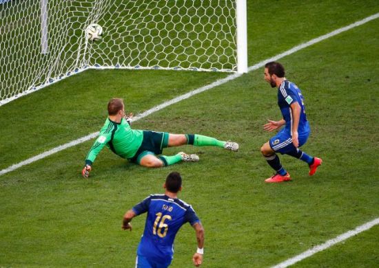 Gonzalo Higuain of Argentina scores a goal past Manuel Neuer of Germany but it was disallowed due to offsides being called