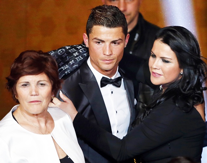 Portugal's Cristiano Ronaldo poses with his mother Dolores Aveiro, left, and sister Katia   Aveiro after being awarded the FIFA Ballon d'Or 2013 in Zurich