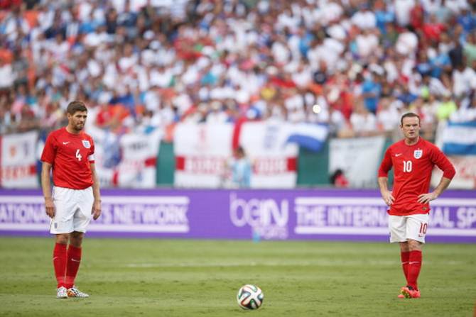 Steven Gerrard and Wayne Rooney of England prepare to take a free-kick during the international friendly match between England and Honduras at the Sun Life Stadium on June 7, 2014 in Miami Gardens, Florida. 