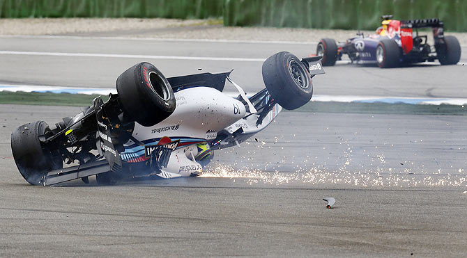 Williams Formula One driver Felipe Massa of Brazil crashes with his car in the first corner after the start of the German F1 Grand Prix at the Hockenheim racing circuit on Sunday