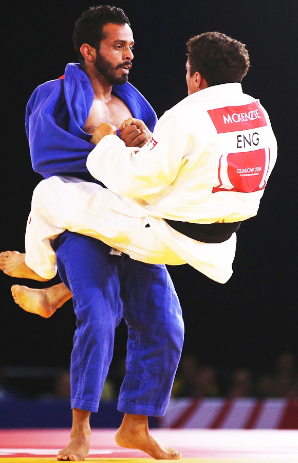 Navjot Chana of India competes against Ashley McKenzie of England in the men's 60kg gold medal contest at SECC Precinct