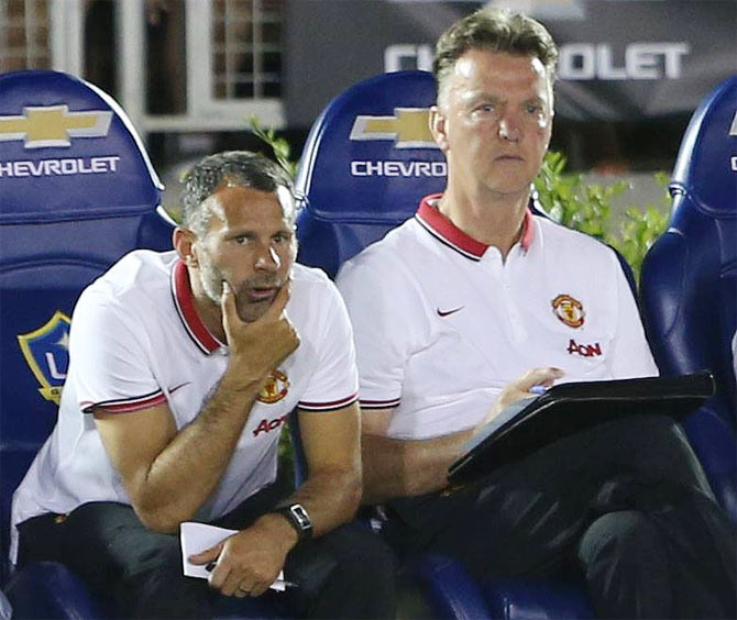 Manchester United's assistant manager Ryan Giggs (left) with new boss Louis van Gaal