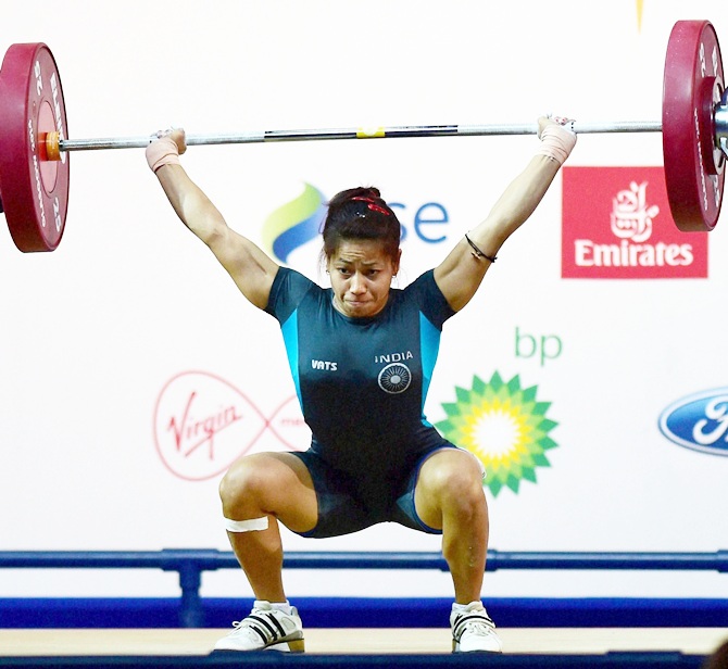 India's Sanjita Khumukcham completes a lift during the 48-kg womens weightlifting event at the Commonwealth Games in Glasgow