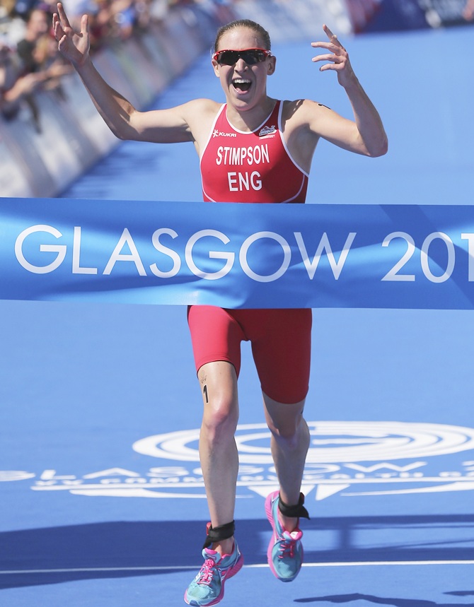 Jodie Stimpson of England celebrates after winning the Women's Triathlon at Strathclyde   Country Park during day one of the Glasgow 2014 Commonwealth Games