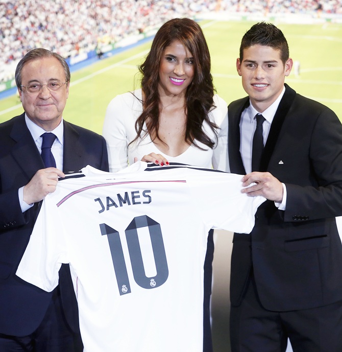 Colombia's soccer player James Rodriguez, right, stands with his wife Daniela and Real Madrid president Florentino Perez