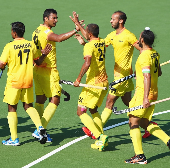 VR Raghunath of India celebrates after scoring from a penalty corner during the Mens   Hockey match between India and Wales at Glasgow National Hockey Centre during day two of   the Glasgow 2014 Commonwealth Games