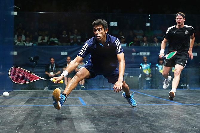 Campbell Grayson of New Zealand and Saurav Ghosal of India (left) in action during the quarter-finals of the Men's Squash at Scotstoun Sports Campus during day three of the Glasgow 2014 Commonwealth Games on Saturday