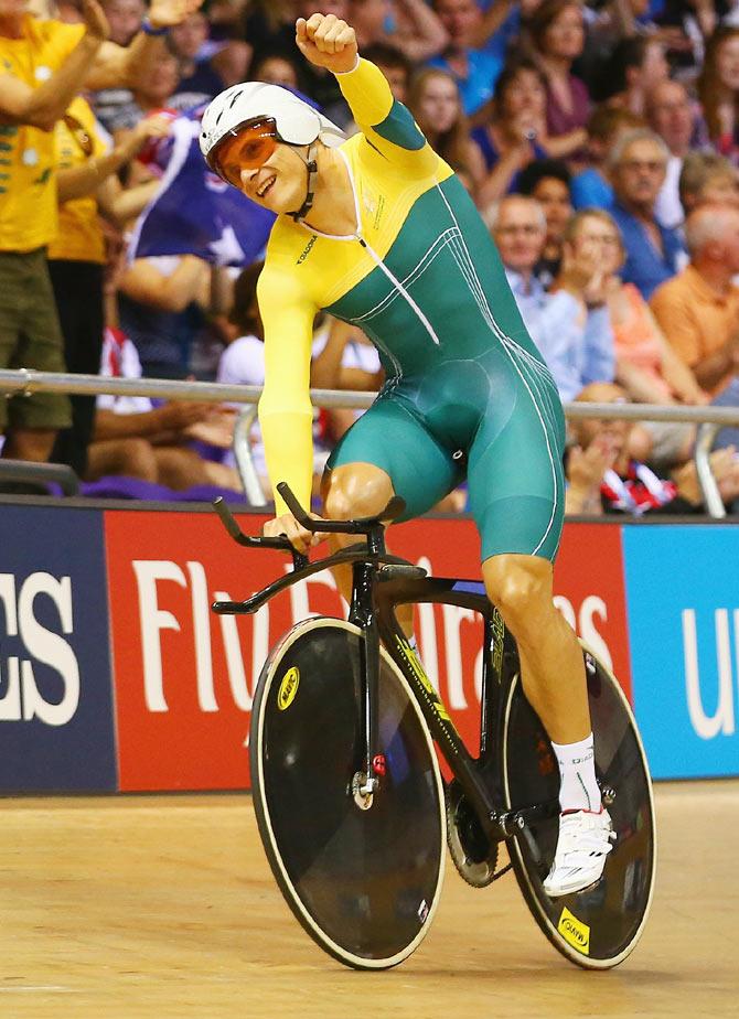 Scott Sunderland of Australia celebrates winning gold after the Men's 1000 metres Time Trial at Sir Chris Hoy Velodrome on Saturday