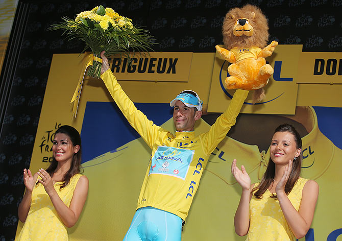 Vincenzo Nibali of Italy and the Astana Pro Team takes the podium after defending the overall race leader's jersey with a fourth place finish in the individual time trial during the twentieth stage of the 2014 Tour de France, a 54km individual time trial stage between Bergerac and Perigueux on Sunday