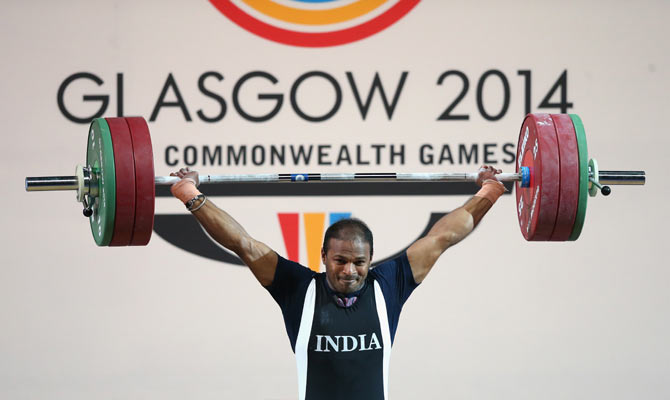Sathish Sivalingam of India wins gold in the Men's Weightlifting 77kg category at Scottish Exhibition And Conference Centre during day four of the Glasgow 2014 Commonwealth Games on Sunday