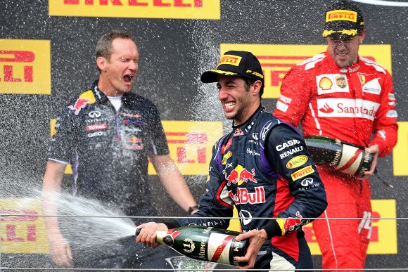Daniel Ricciardo of Australia and Infiniti Red Bull Racing celebrates victory on the podium