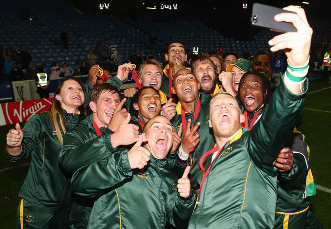 The South Africa team take a selfie after winning the Rugby final against New Zealand to take gold at Ibrox Stadium on Sunday