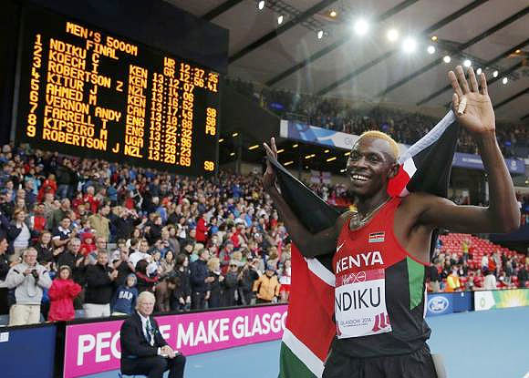 Kenya's Caleb Mwangangi Ndiku celebrates after winning the men's 5000m final at the 2014 Commonwealth Games in Glasgow on Sunday
