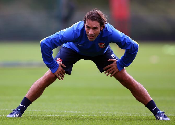 Robert Pires warms up during an Arsenal training session