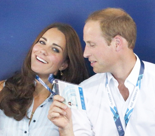 Duchess of Cambridge, sits with her husband Prince William
